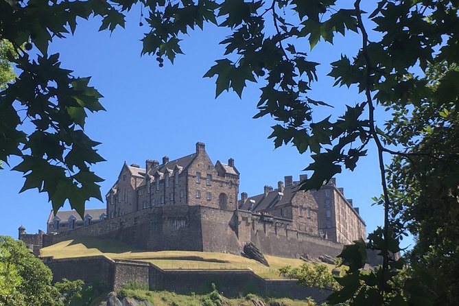 Edinburgh Castle, perched atop an ancient volcanic rock, dominates the city's skyline with its imposing presence and rich architectural heritage, offering visitors a glimpse into Scotland's turbulent past and royal history.