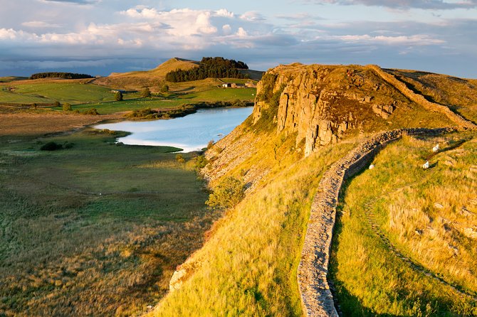 Hadrian's Wall in Scotland stands as a stoic testament to ancient engineering and imperial ambition, stretching across rugged landscapes with its weathered stones, offering a poignant glimpse into the Roman Empire's enduring legacy in the region.