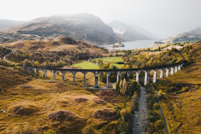 As you ride the Hogwarts Express, you'll witness the awe-inspiring beauty of the Scottish Highlands, where misty mountains and glistening lochs glide past the train's windows, immersing you in a journey through one of Scotland's most captivating landscapes filled with magic.